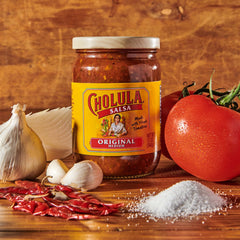 Cholula original salsa used as taco topping adding authentic Mexican flavor
