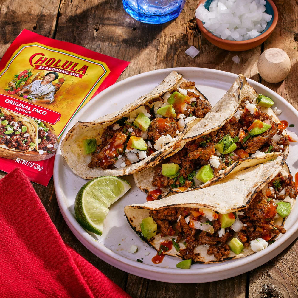 Cholula packets next to measuring spoon showing proper portion guidance