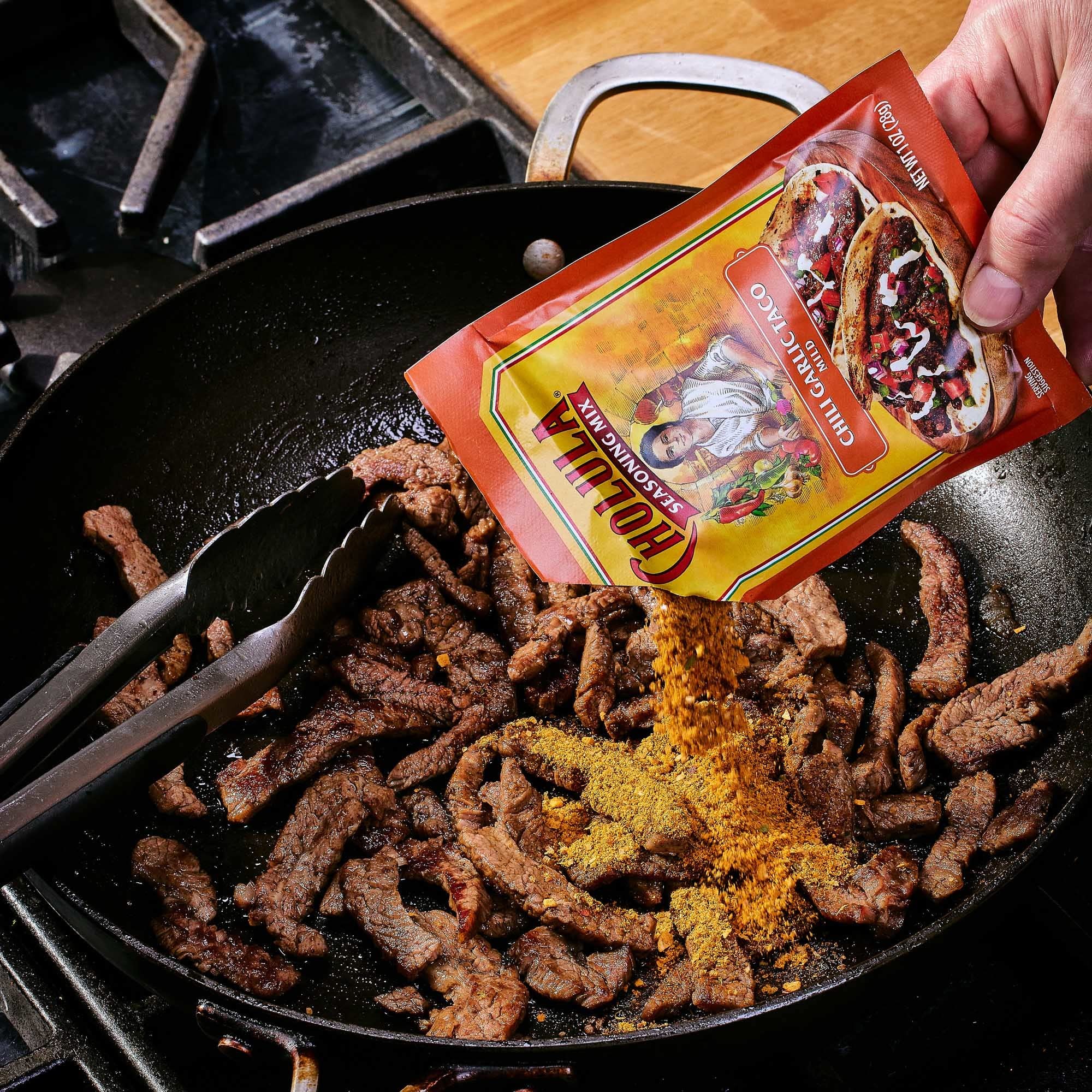 Cholula seasoning stirred into queso dip adding rich chili-garlic taste