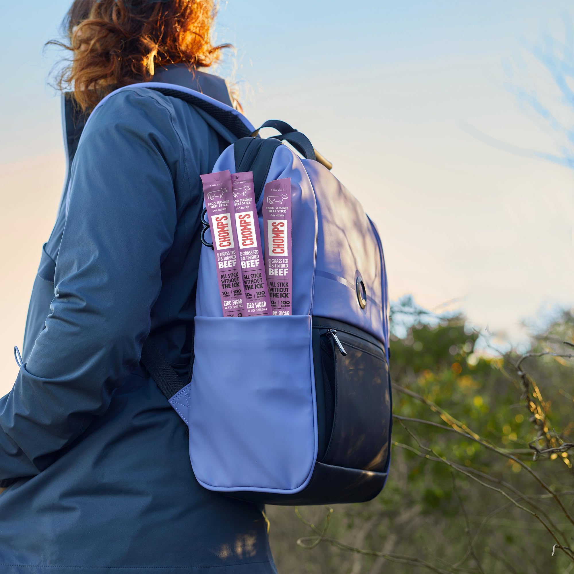 Chomps sticks inside backpack showing portability for travel and hikes