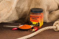 Chugwater Chili seasoning texture pouring from tub for easy measuring