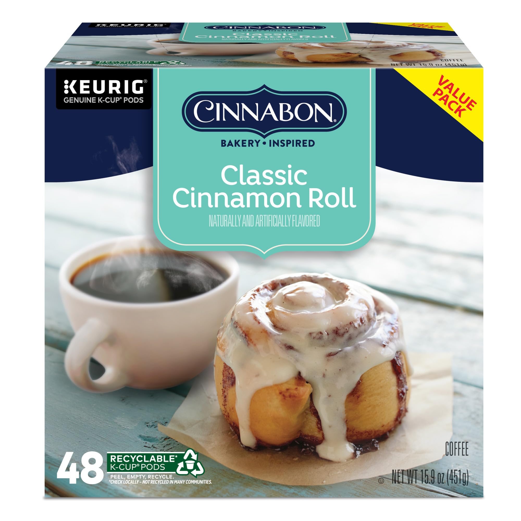 CINNABON cup styled with pastry in breakfast setting suggesting indulgence
