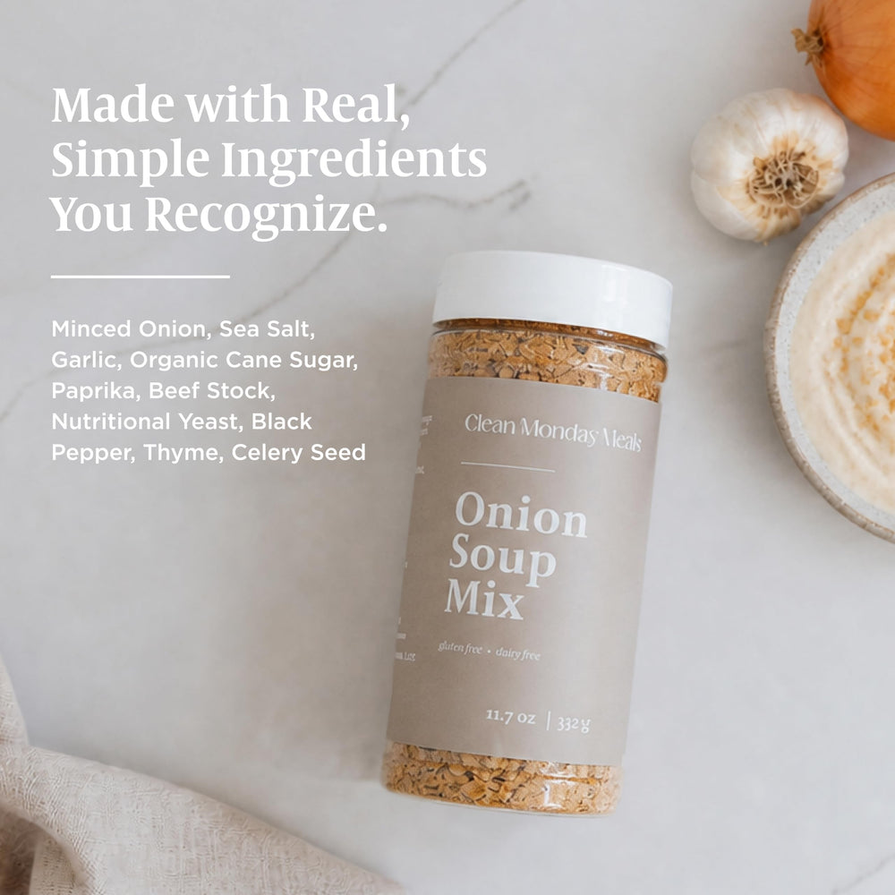 Clean Monday Meals jar beside fresh onions and garlic showing clean ingredients and culinary use