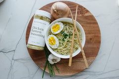 Clean Monday Meals seasoning sprinkled on ramen bowl for richer taste