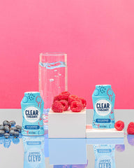 Clear Theory drops dispersing into a glass demonstrating quick flavor infusion