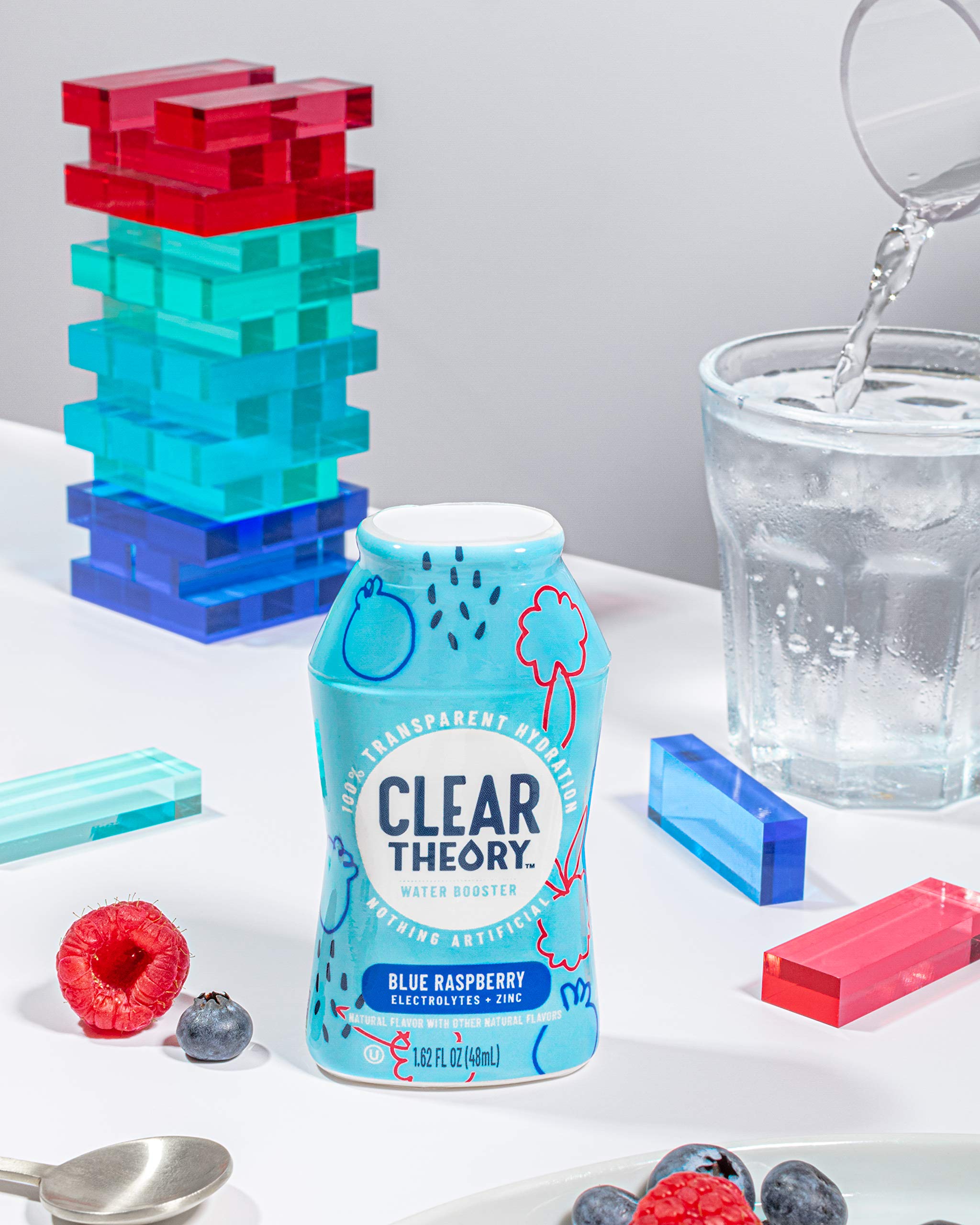 Clear Theory bottle held in hand to show compact travel-friendly size