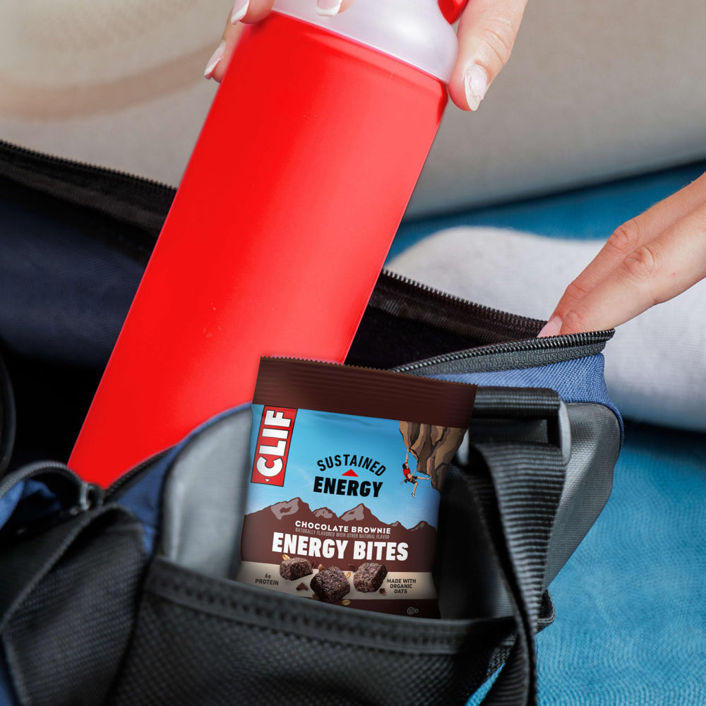 CLIF BAR Energy Bite held in hand to show single-serve size