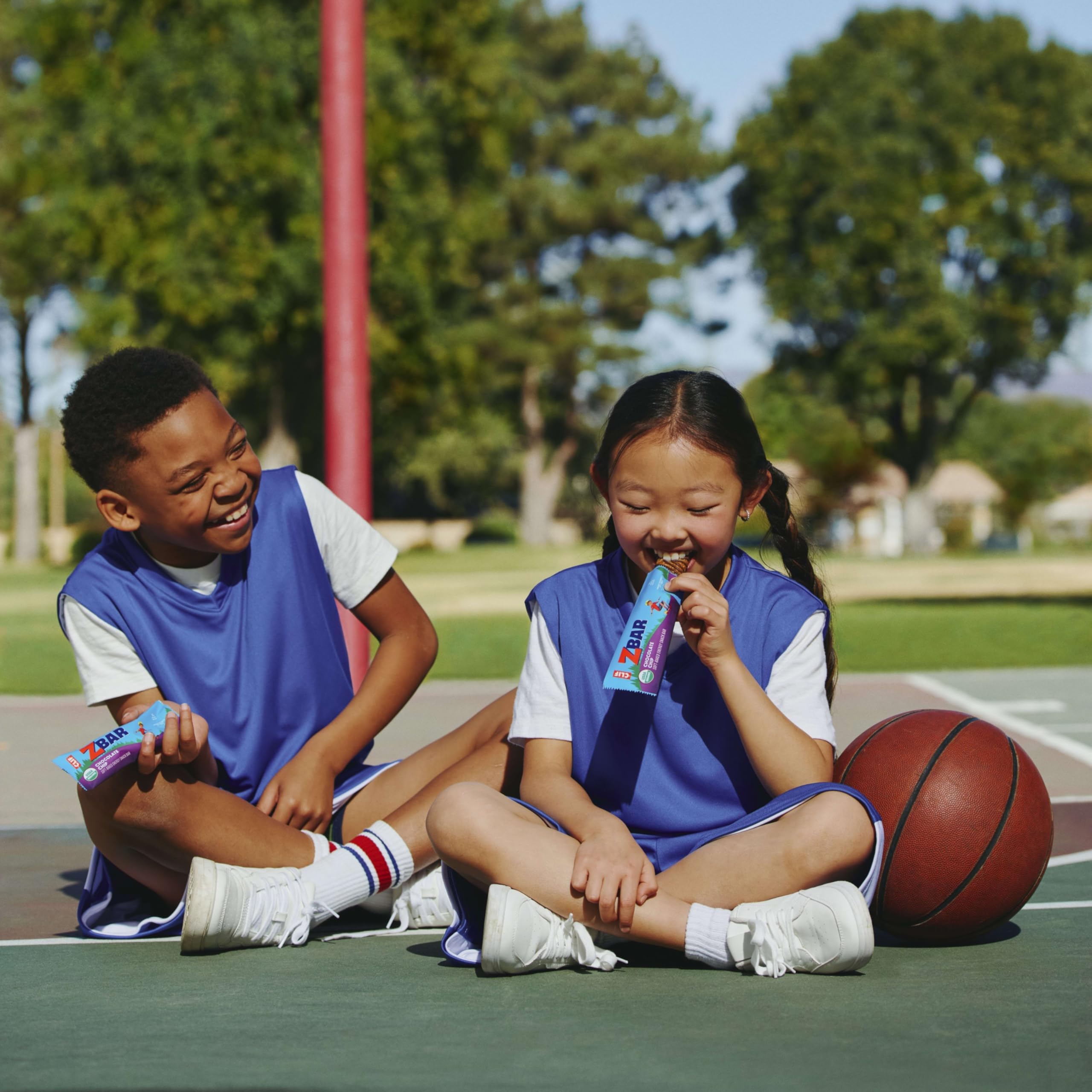 Children enjoying Clif Kid Zbar outdoors for quick, on-the-go energy