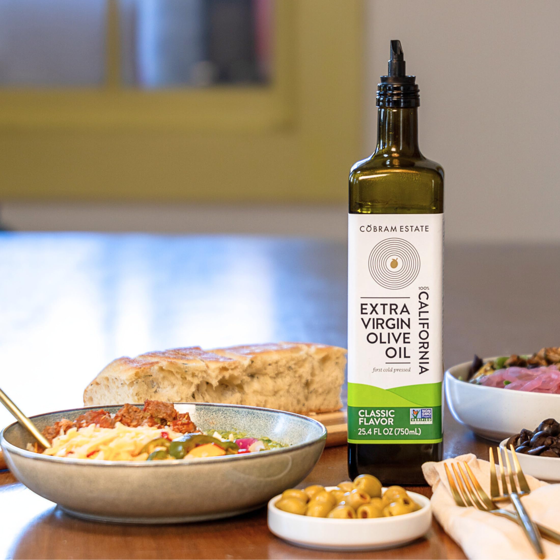 Cobram Estate drizzling over salad to enhance flavor and fresh presentation