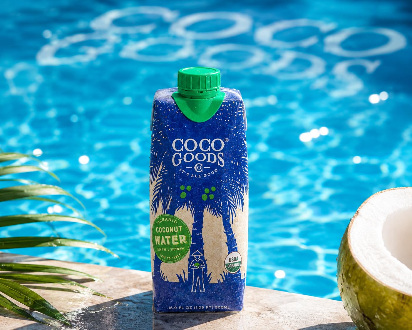 CocoGoodsCo bottle in hand to show size and portability for on-the-go hydration benefit