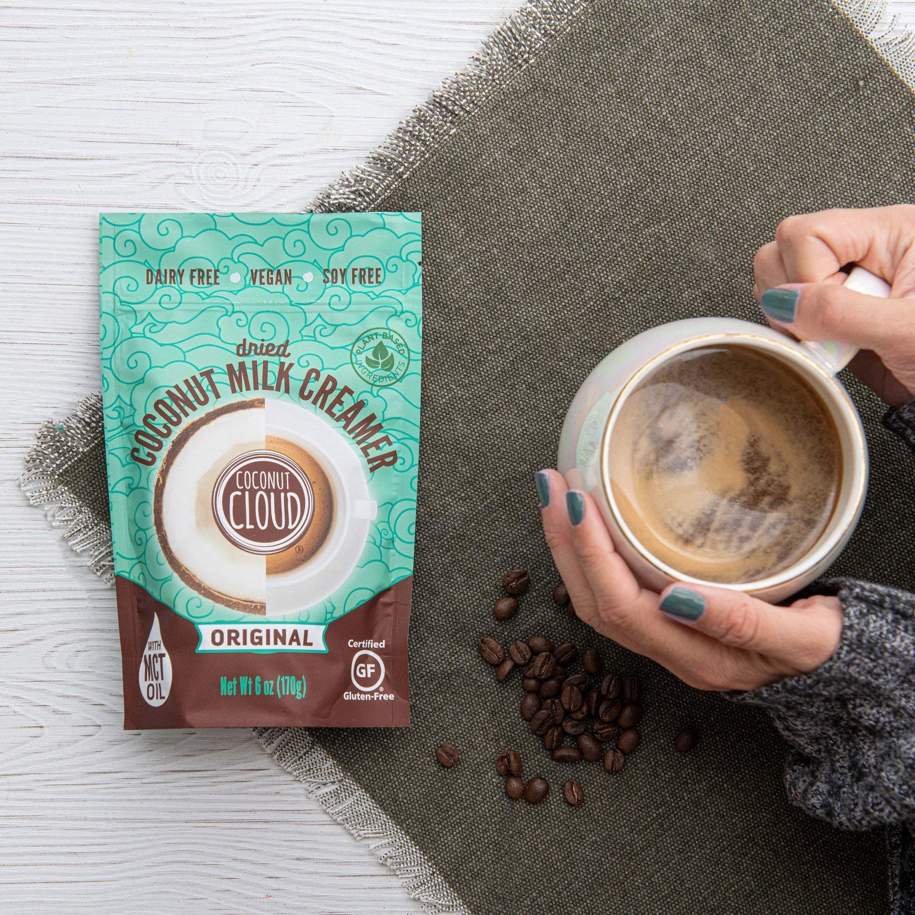 Coconut Cloud dissolving in coffee creating creamy texture and richer flavor