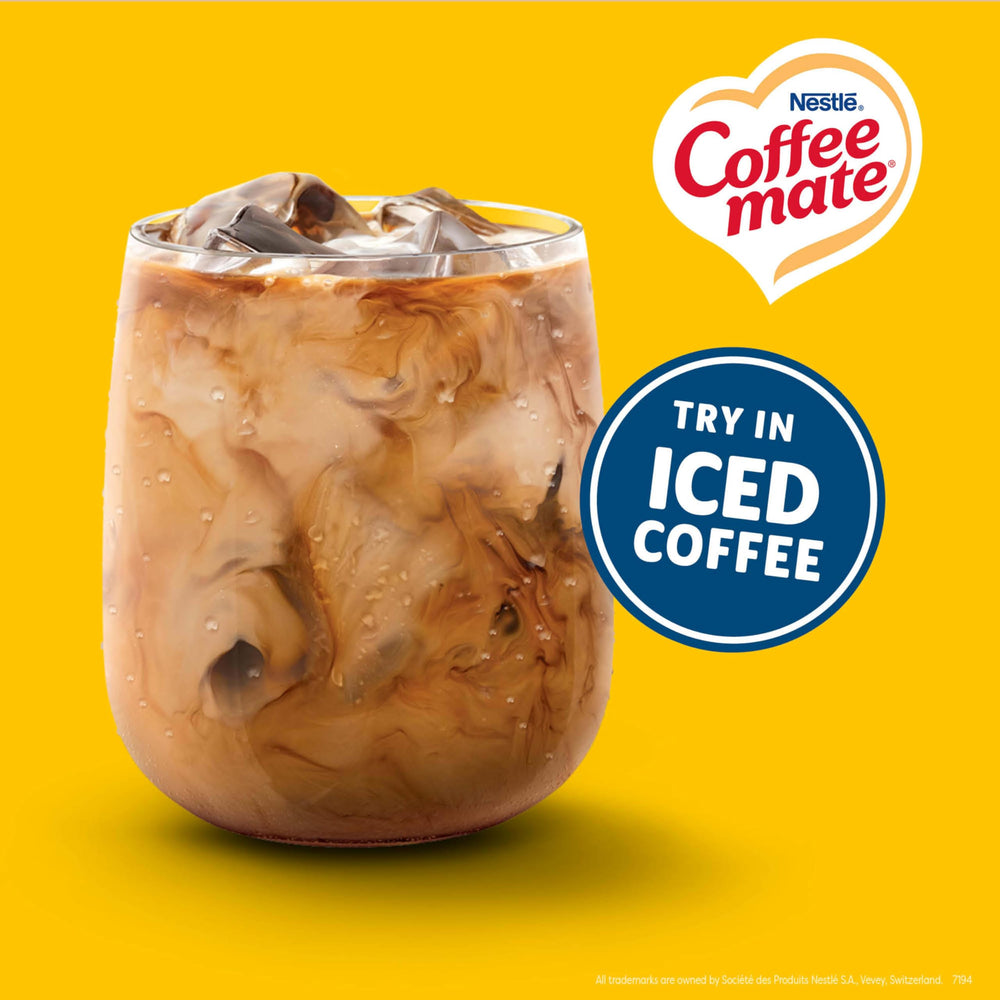Close-up of creamer blending into black coffee showing creamy texture benefit