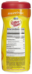 Coffee-mate pouring creamer into coffee with visible creamy texture and quick dissolution