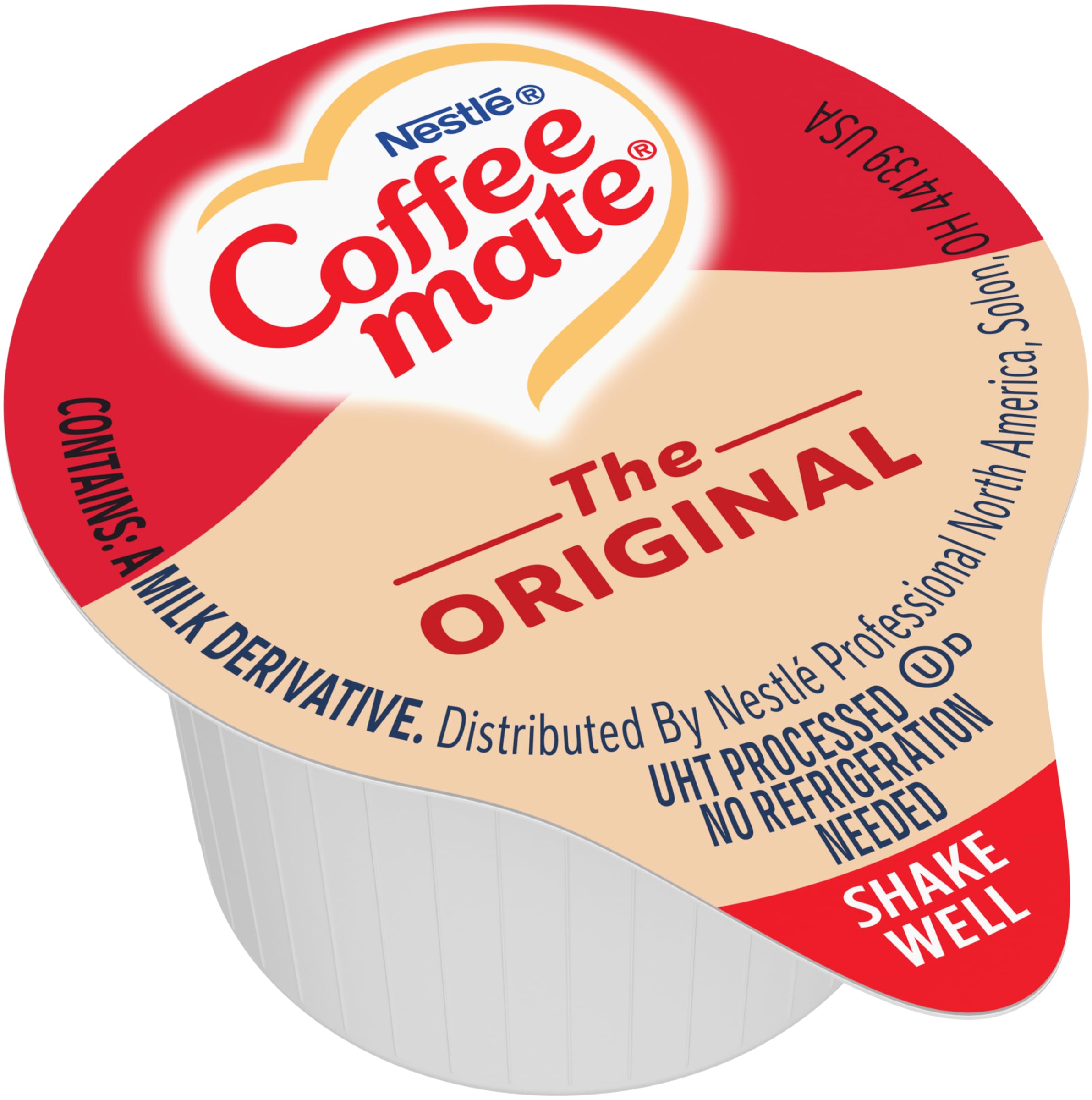 Coffee-mate tub being poured into a coffee cup demonstrating smooth blending and portion control
