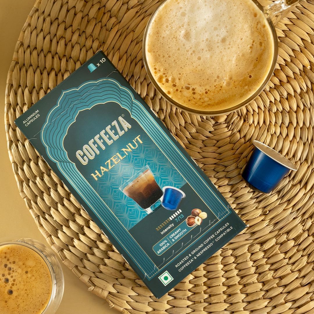 Coffeeza pods spilled on table demonstrating convenient single-serve use benefit