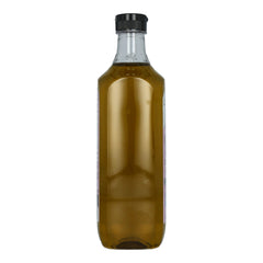 Colavita bottle being poured over salad showcasing flavor addition and visual gloss benefit
