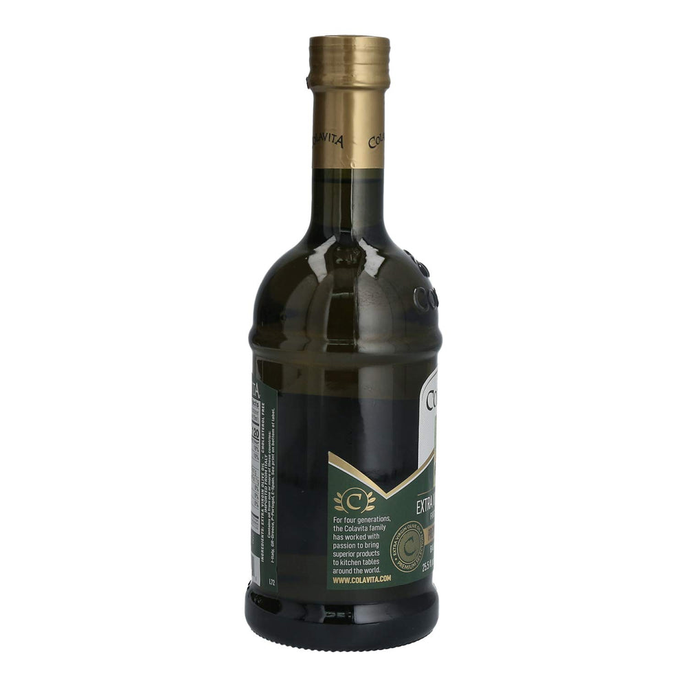 Colavita bottle beside fruit and measuring cup to show size and serving versatility