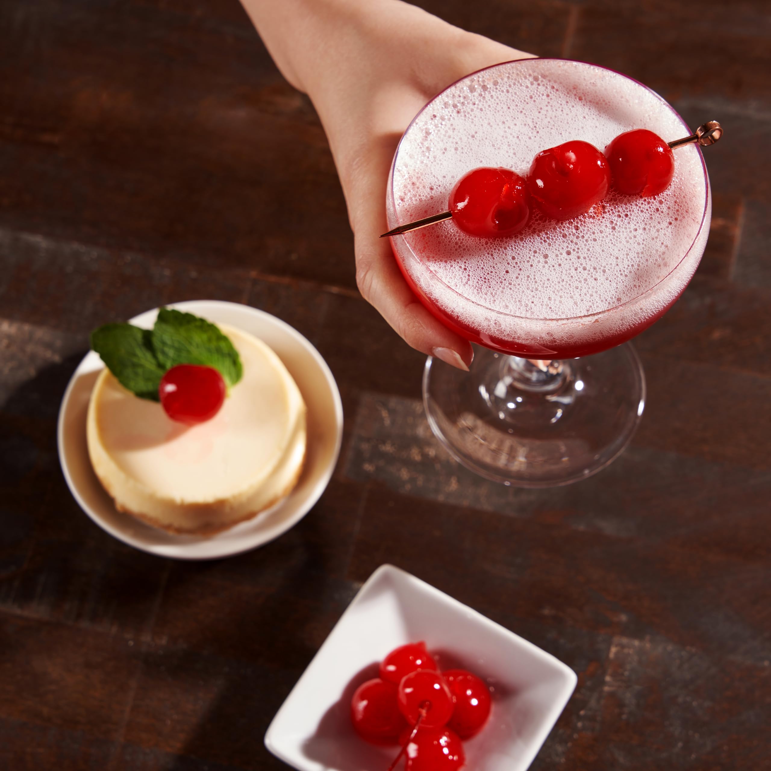 Collins Chicago cherries placed on a cocktail rim providing instant professional garnish