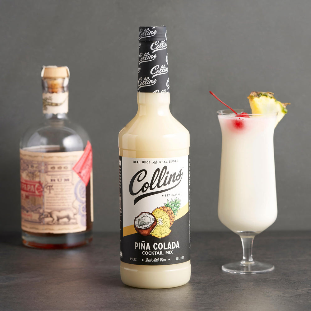 Collins bottle staged on home bar counter with tiki glass, inspires entertaining
