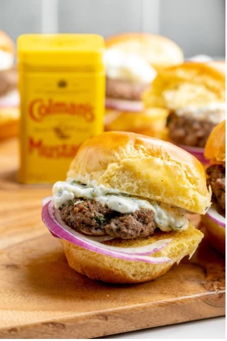 Colman's mustard being blended into a dry rub on meat for enhanced grilling flavor
