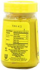 Colman's open jar with spoonful of mustard, ready to add bright heat to dishes
