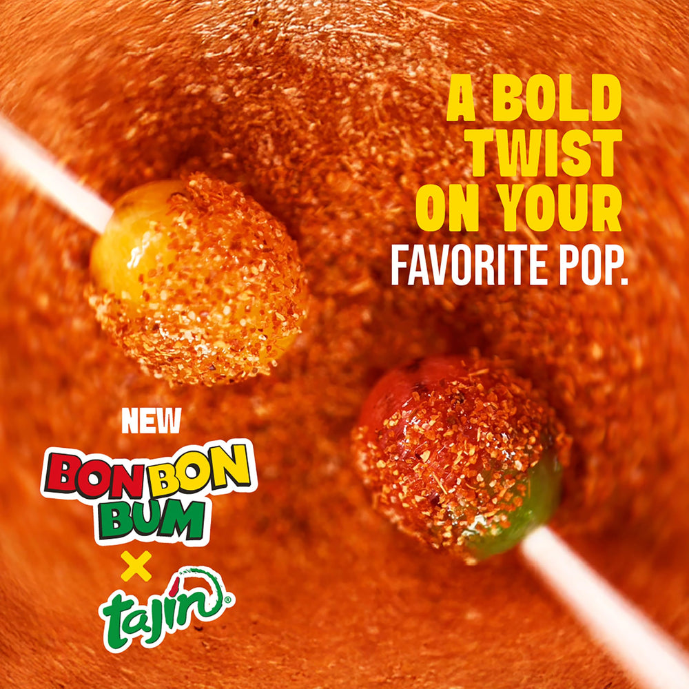Colombina lollipop being dipped into Tajín adding zesty flavor and interactive fun