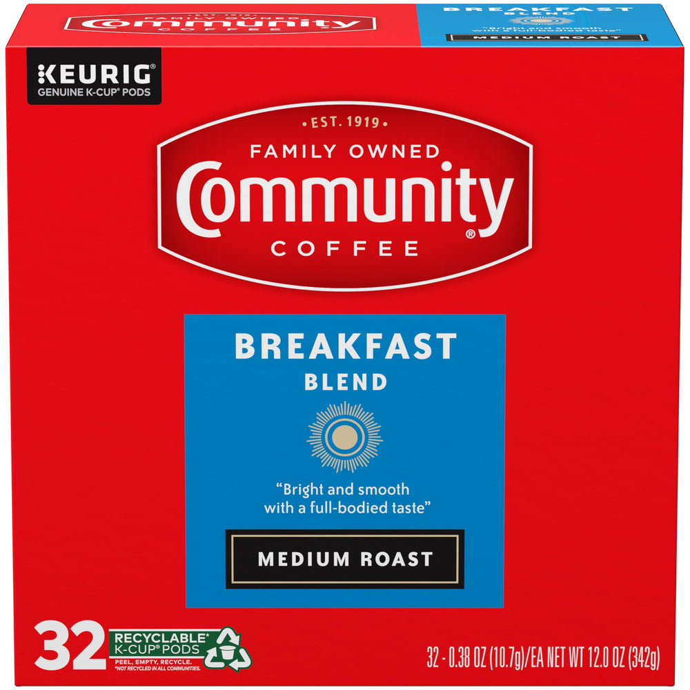 Community Coffee brewed cup pouring from Keurig with steam for a fresh morning cup