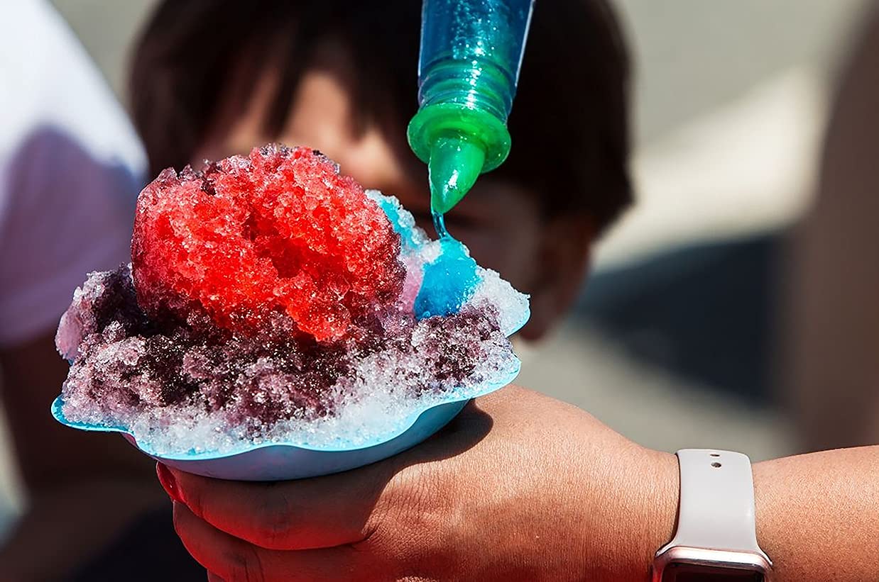 Concession Essentials snow cones in use at a party, bright flavors appealing to kids and guests