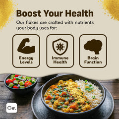 Coolinario flakes sprinkled on popcorn adding savory, cheesy flavor