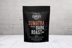 Cooper's Cask close-up of roasted Sumatra whole beans, shows rich dark roast texture