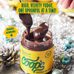 Coop's hot fudge on a spoon showing thick scoopable texture for easy topping