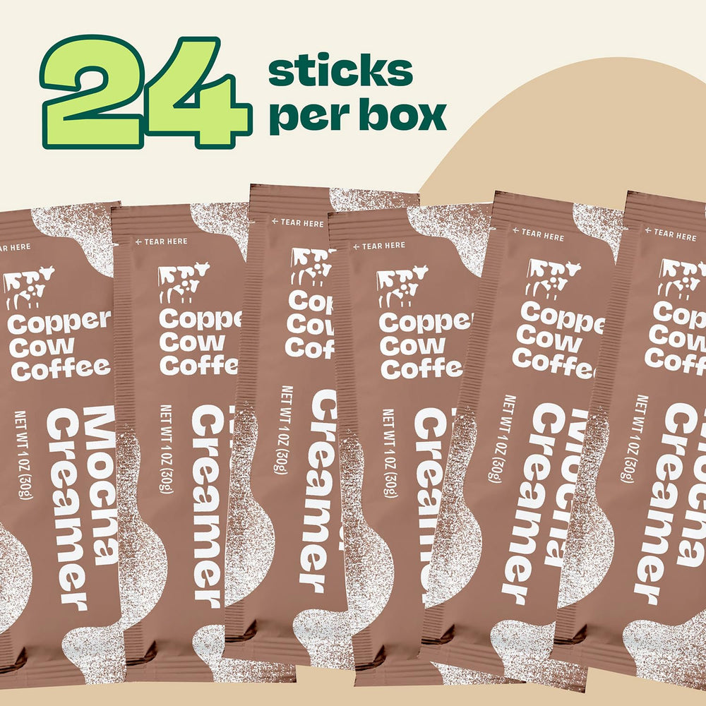 Copper Cow Coffee packets staged on an office desk demonstrating on-the-go convenience and fresh flavor