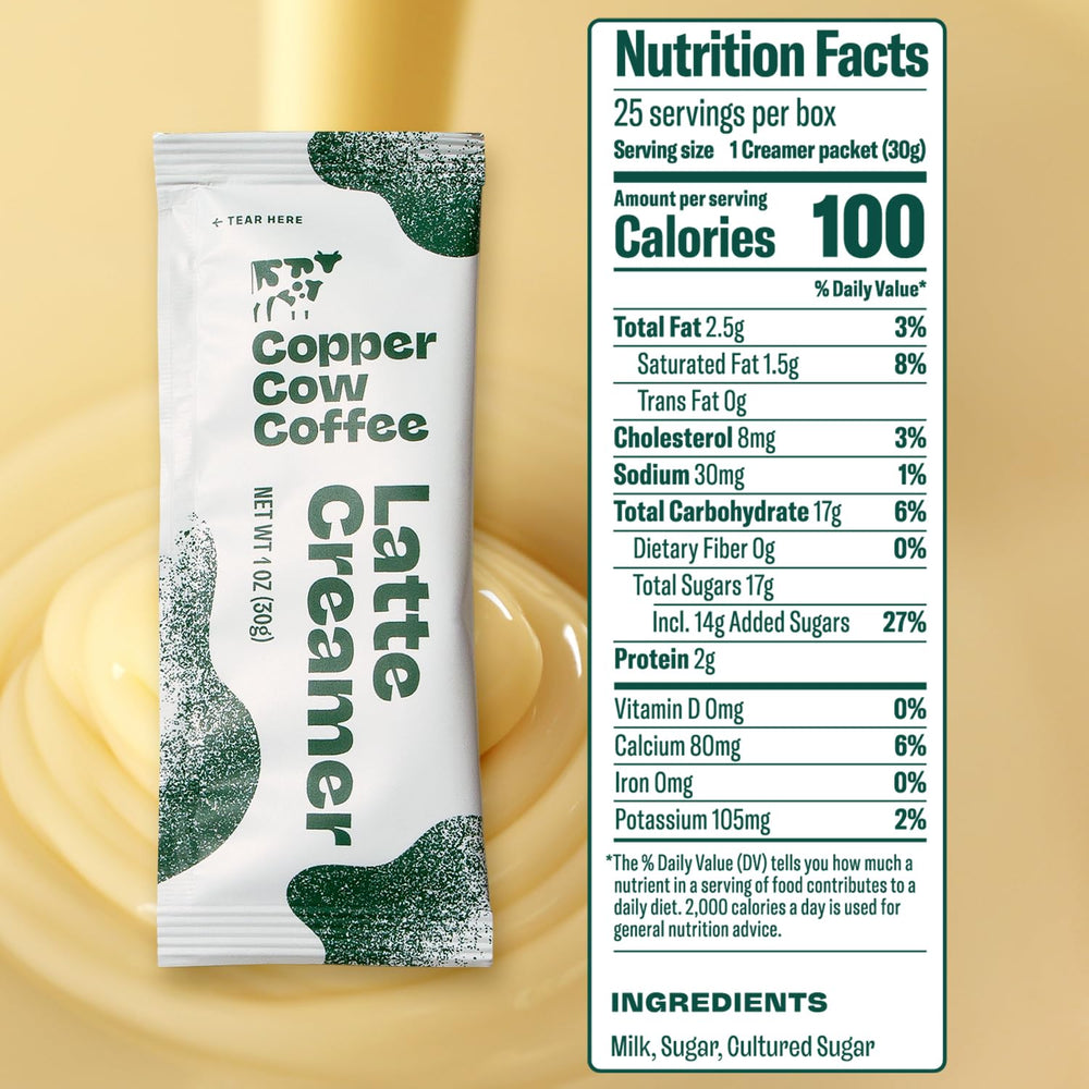 Copper Cow Coffee single packet opened on spoon illustrating easy single-serve use