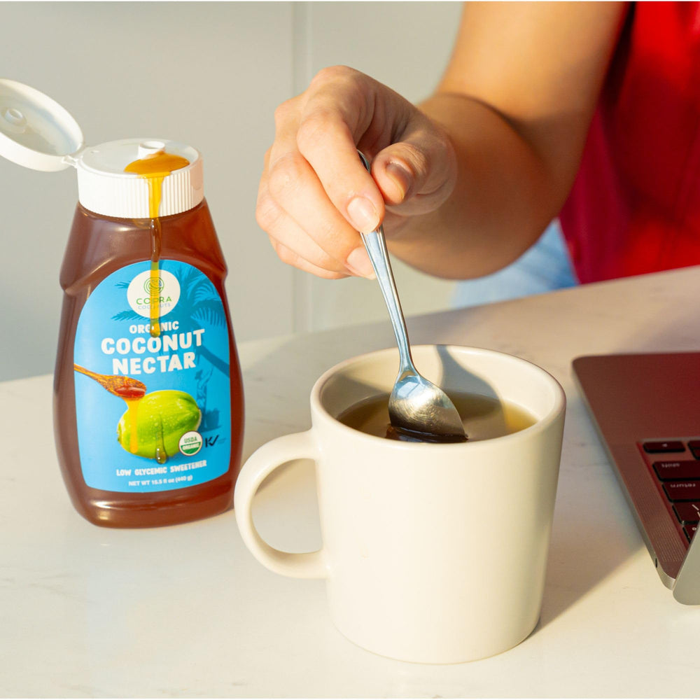 Copra syrup stirred into tea showing quick sweetening and warm flavor