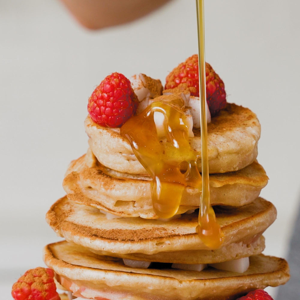 Copra syrup poured over pancakes showing rich caramel flavor and visual appeal