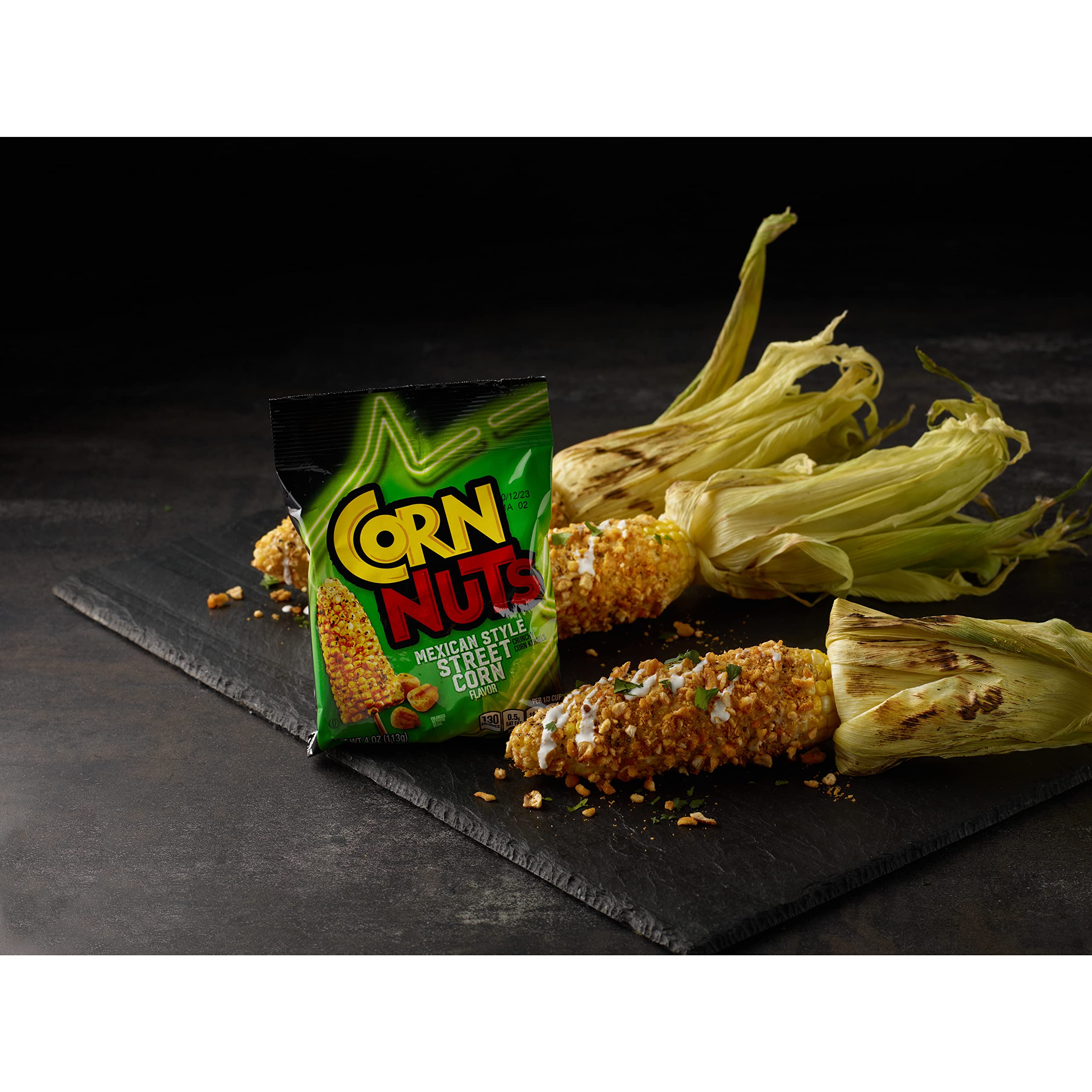 Hand holding a 4 oz Corn Nuts bag to show convenient portable portion size