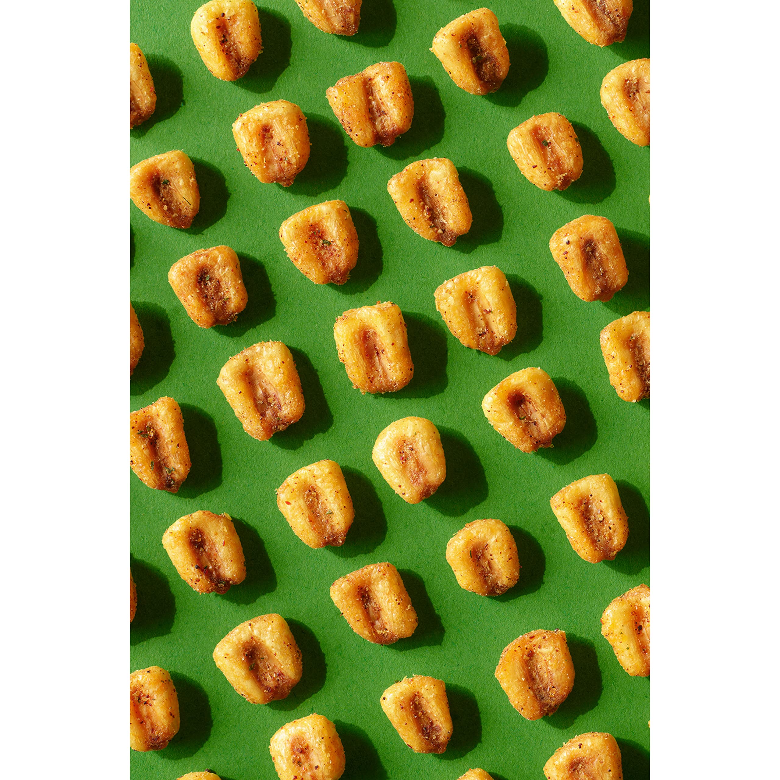 Friends enjoying Corn Nuts during gaming night showing social snacking and pairing