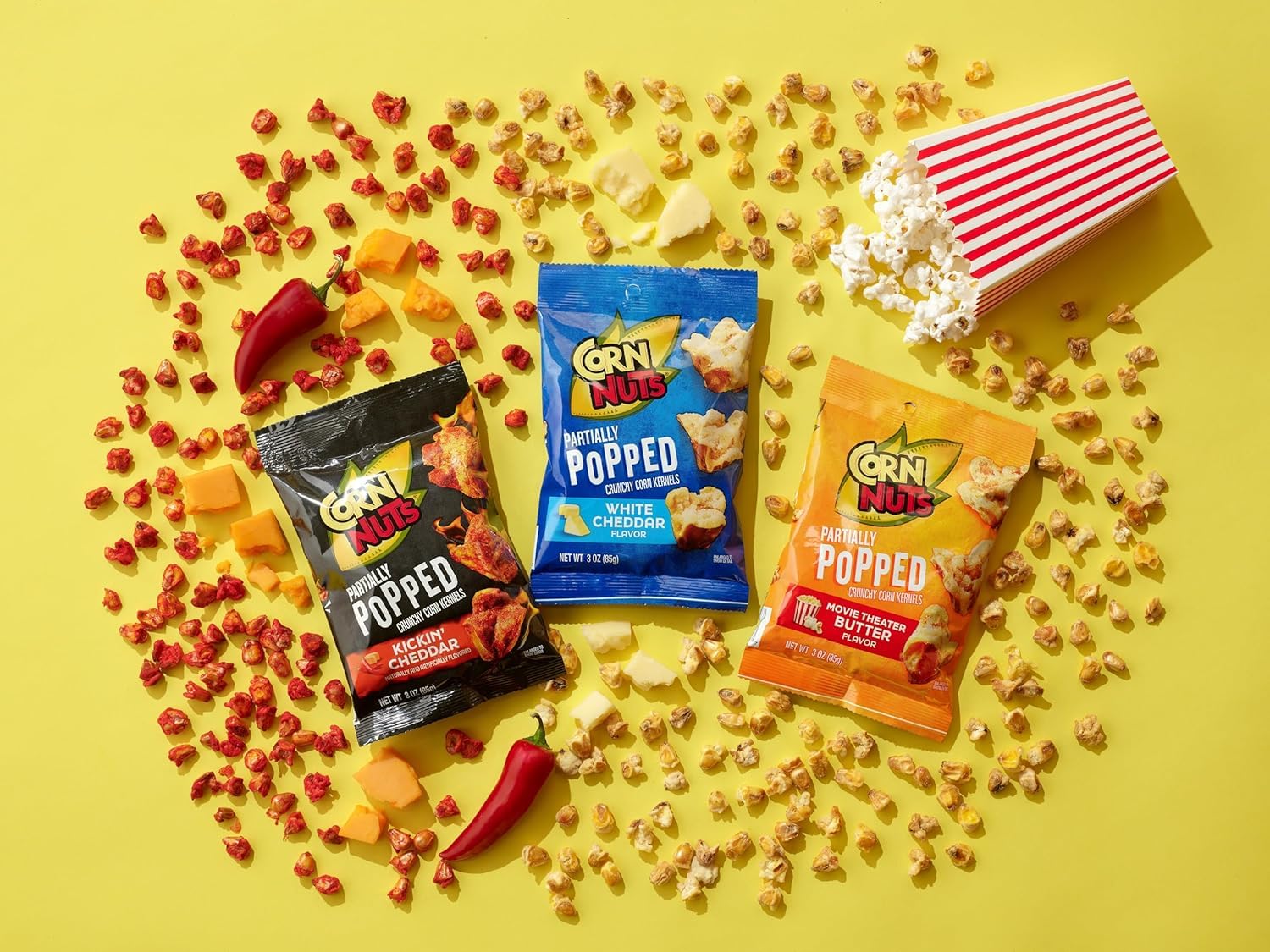 Corn Nuts Kickin’ Cheddar kernels on a spoon showing dense, long-lasting crunch