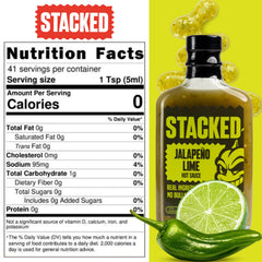Crippling Hot Sauce drizzled on tacos adding tangy lime flavor and medium heat