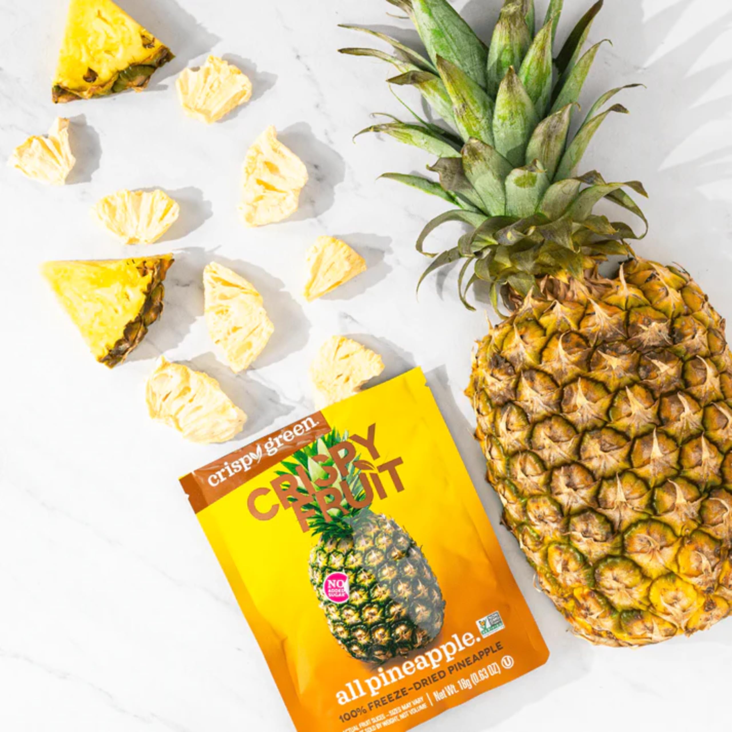 Crispy Green pineapple snacks on picnic spread offering mess-free tropical flavor