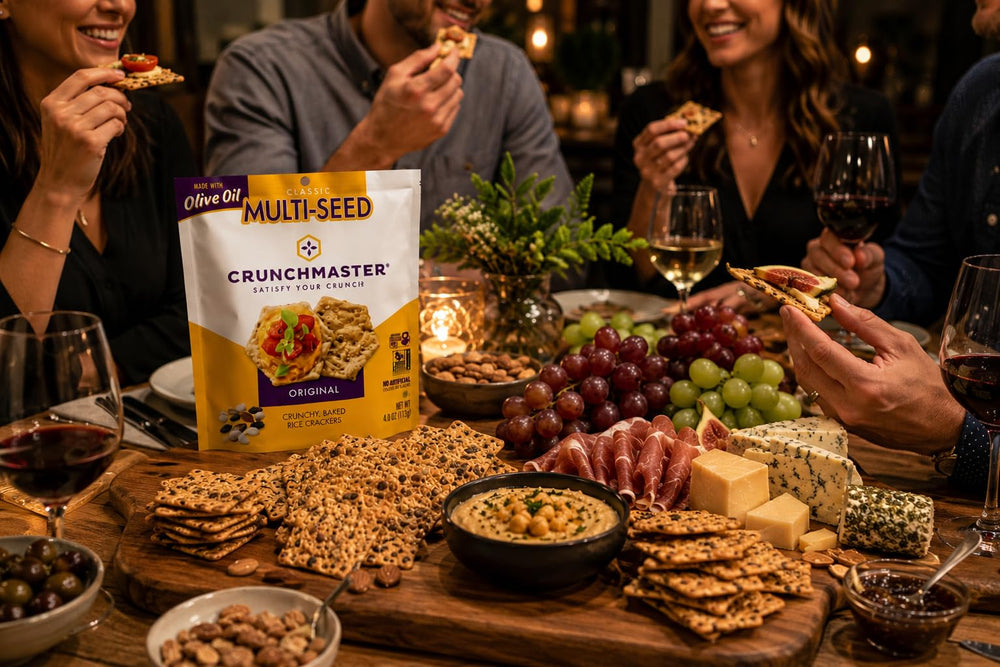 Crunchmaster crackers on a table with dips showing party and everyday appeal