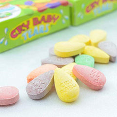 Cry Baby open box showing tear-shaped candies and portability benefit