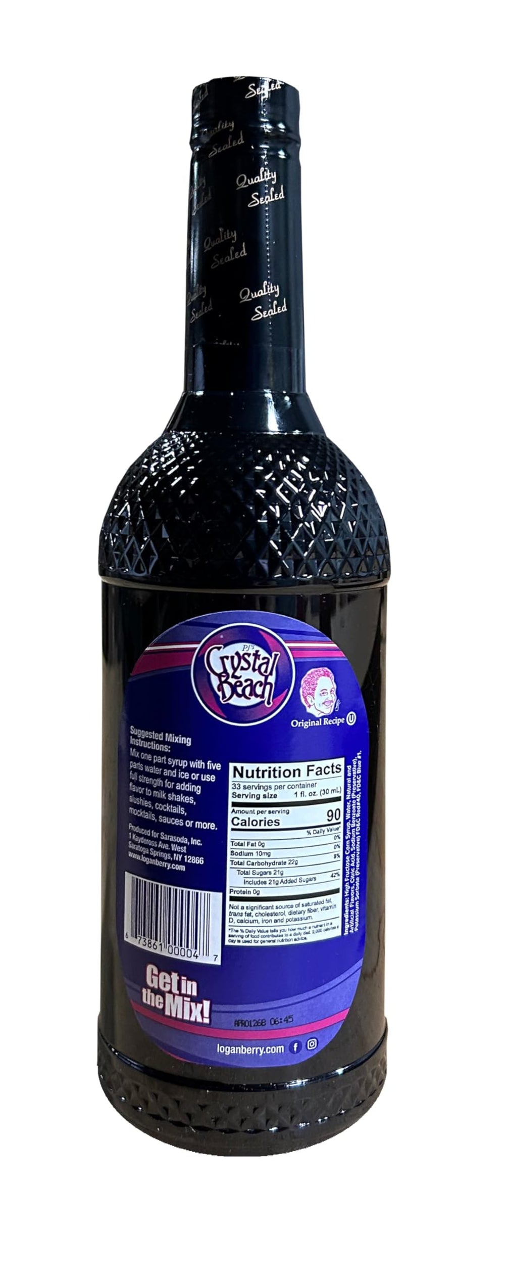 Crystal Beach syrup poured into glass adding bright berry flavor to a drink