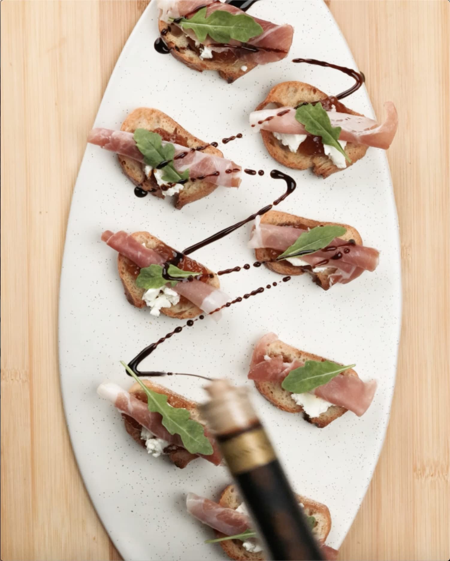 Cucina & Amore pan reduction spoon showing concentrated flavor benefit