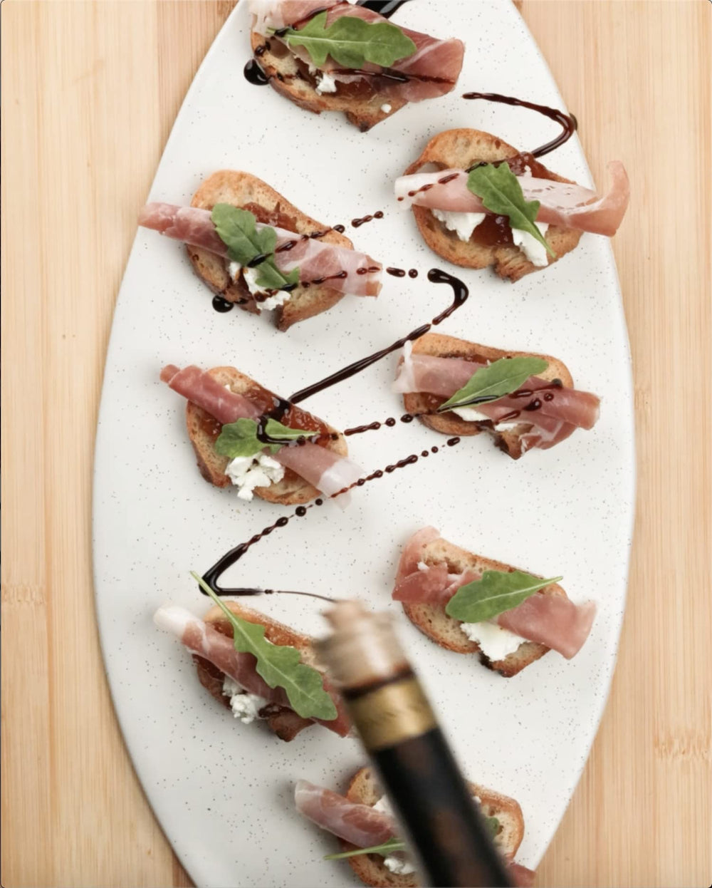 Cucina & Amore pan reduction spoon showing concentrated flavor benefit