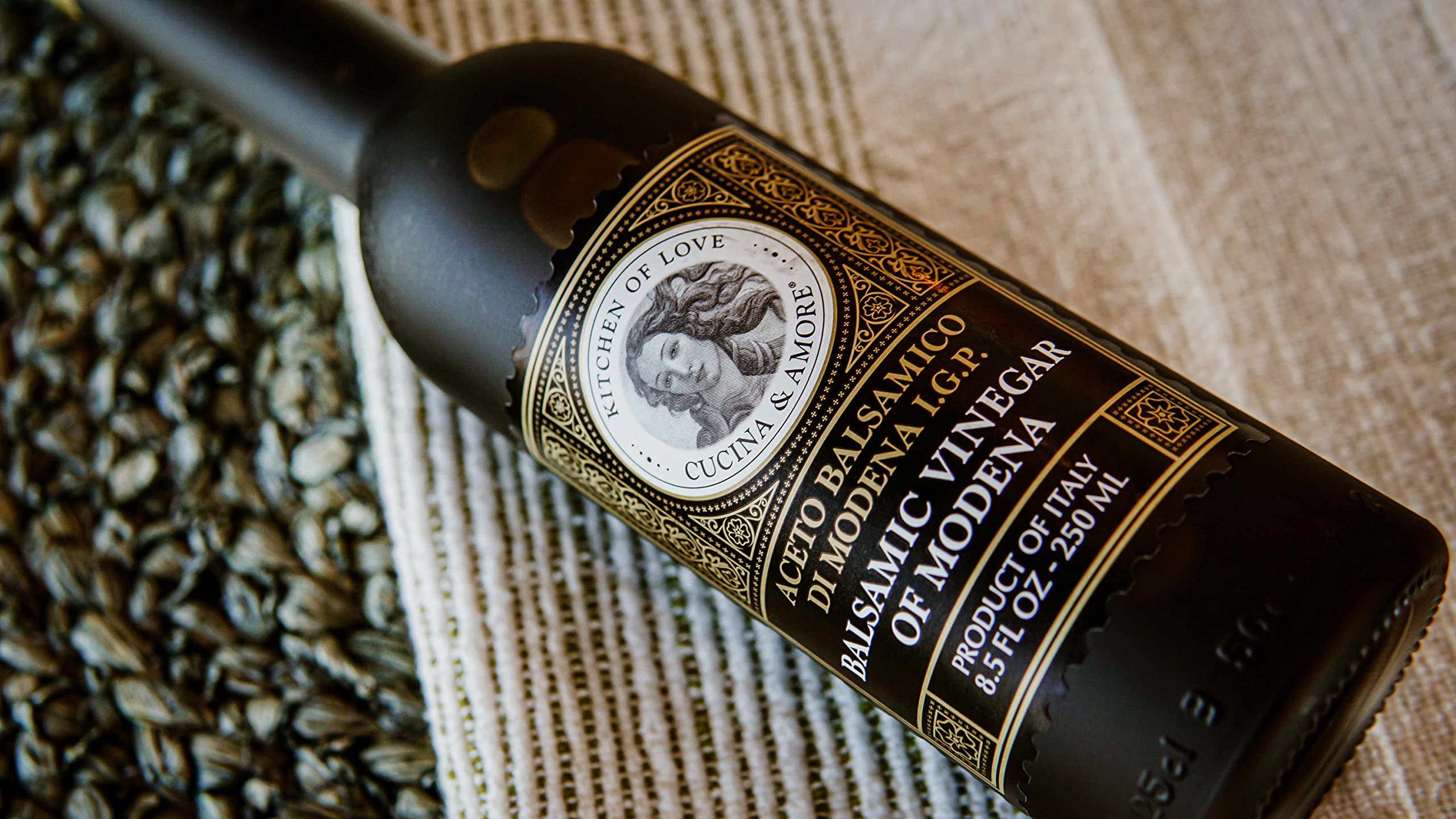 Cucina & Amore bottle in kitchen setting illustrating versatile use benefit