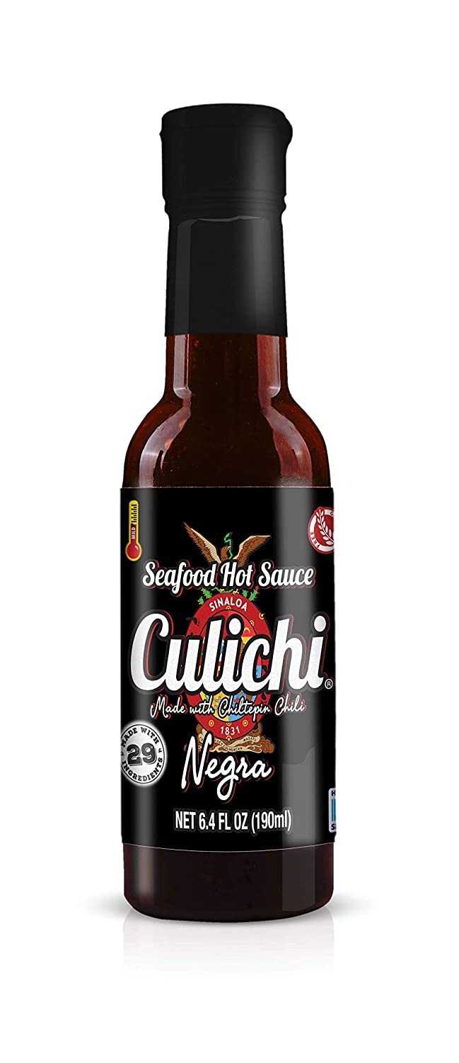 Culichi Chiltepin bottle pouring over ceviche adding sharp pepper brightness
