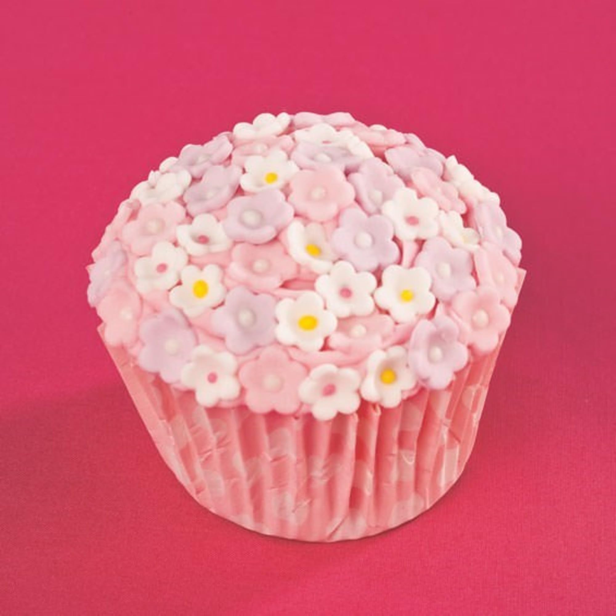 Culpitt mini flowers arranged on a frosted cupcake, adds instant professional finish