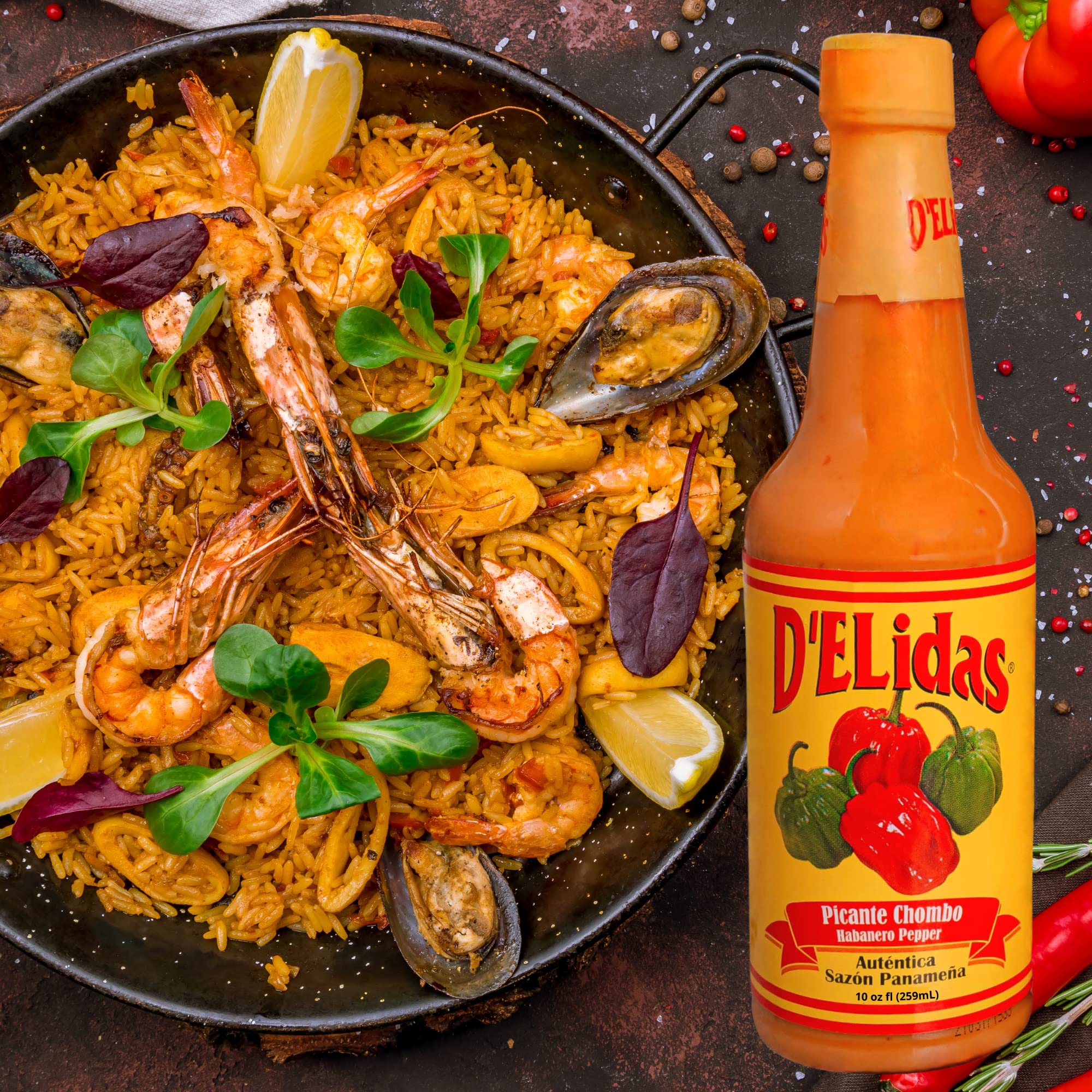 D'ELidas bottle beside habaneros and tomatoes showing natural ingredients benefit