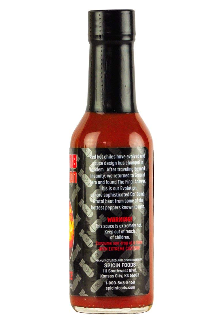 Da'Bomb bottle next to measuring spoon showing portion size and heat control